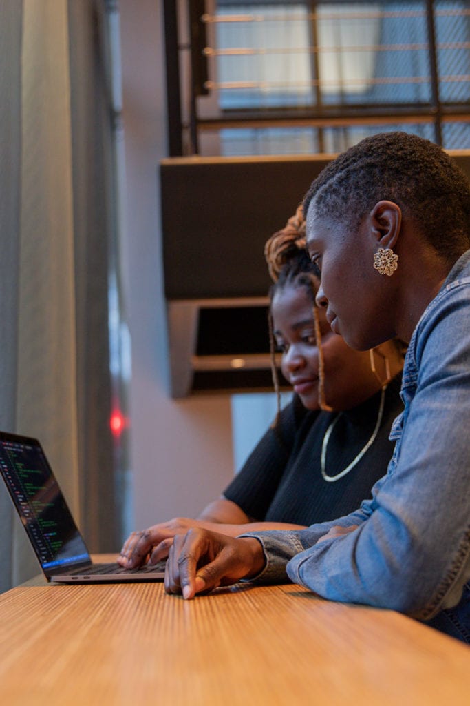 Resilient Coders working on laptop